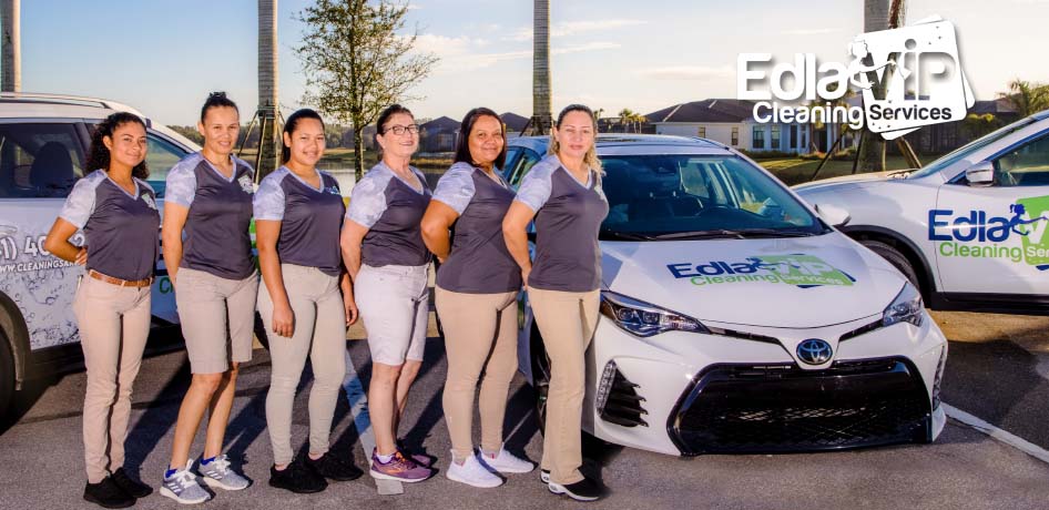 A group of women standing in front of a car after completing their professional cleaning services in Sarasota.