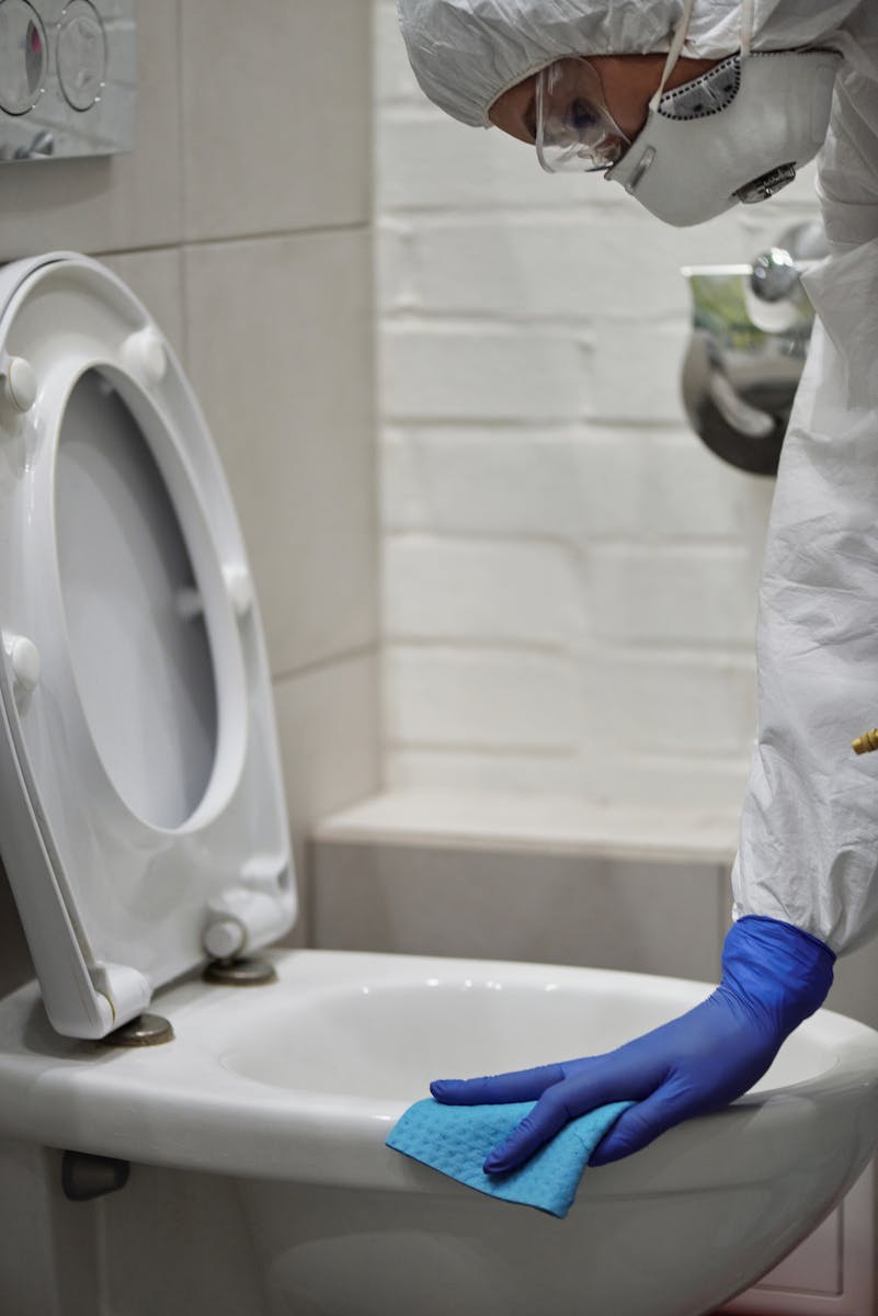 Professional Doing Bathroom Cleaning